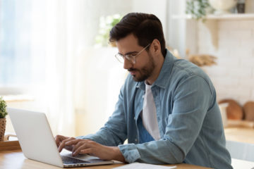 Man using all-in-one roofing software to run his business