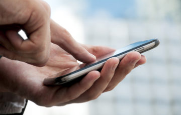 Man using a roofing contractor app.