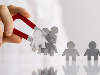 Magnet collecting people.