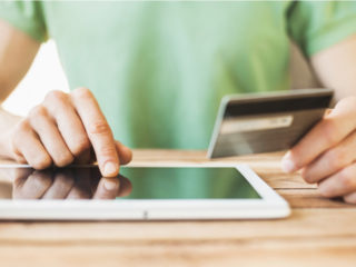 Roofer collecting a payment after sending an invoice.