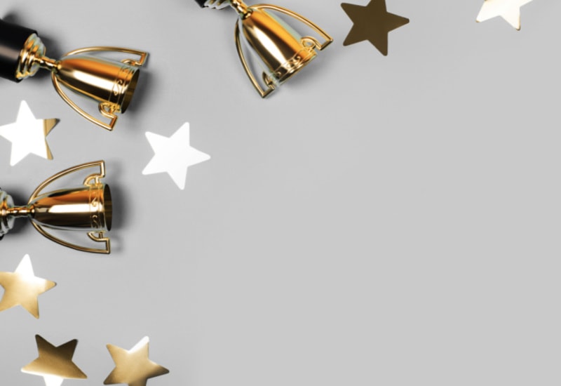 Gold awards trophies and gold stars
