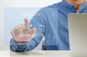 Man clicking on roofing podcasts